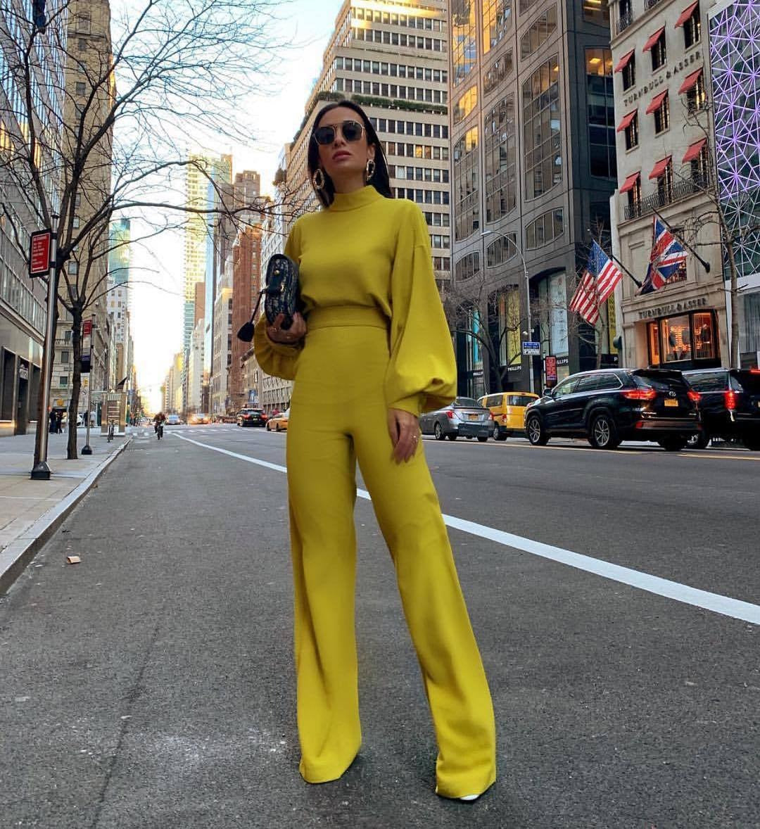 Solid color high neck backless long sleeved casual jumpsuit